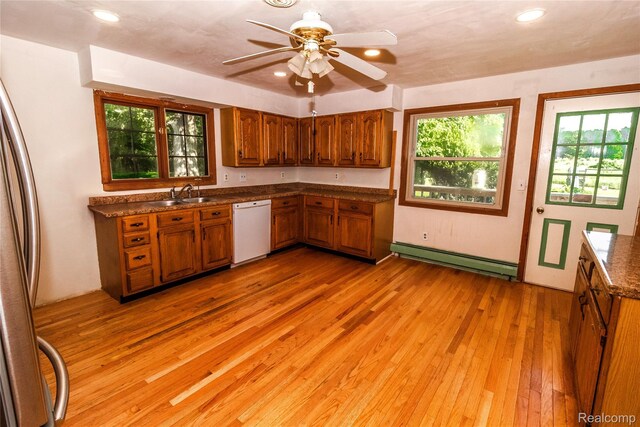 2380 Wilder Rd, Metamora, MI 48455 - kitchen with brown cabinetry, light wood-style floors, a baseboard heating unit, ceiling fan, and recessed lighting