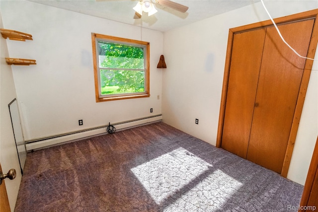 2380 Wilder Rd, Metamora, MI 48455 - unfurnished bedroom with carpet, a baseboard heating unit, a closet, and a ceiling fan
