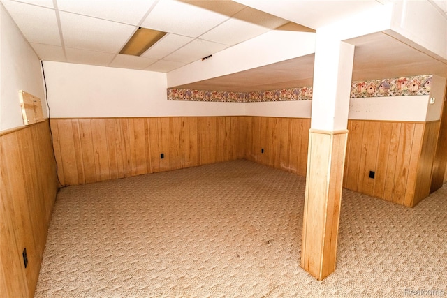 2380 Wilder Rd, Metamora, MI 48455 - finished basement with a wainscoted wall, wood walls, light carpet, and a drop ceiling