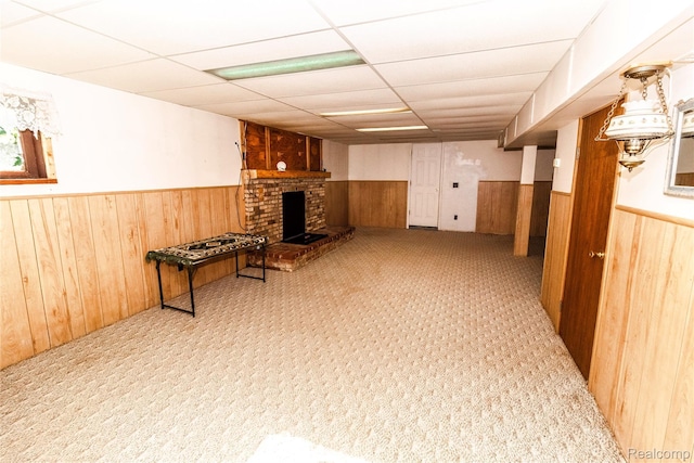 2380 Wilder Rd, Metamora, MI 48455 - finished below grade area with wainscoting, wooden walls, a drop ceiling, and a fireplace