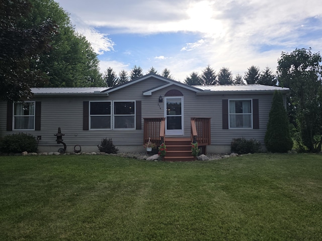 274 Pioneer St, Mendon, MI 49072 - manufactured / mobile home with a front yard and a metal roof