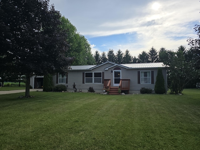 274 Pioneer St, Mendon, MI 49072 - view of front of home with a front lawn and a metal roof