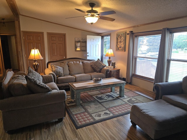 274 Pioneer St, Mendon, MI 49072 - living room featuring crown molding, vaulted ceiling, ceiling fan, wood finished floors, and a textured ceiling