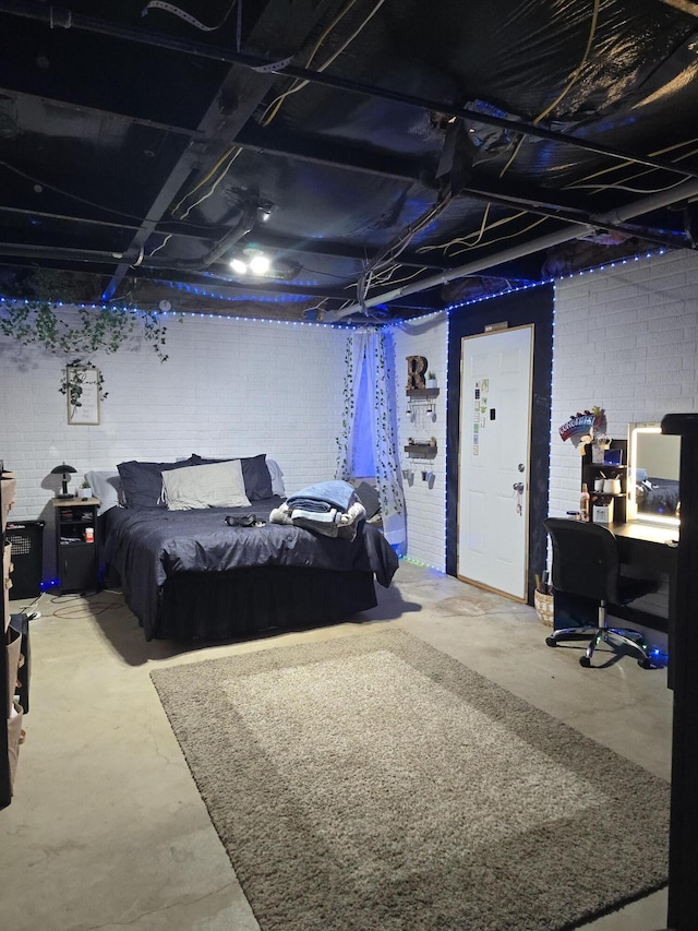 274 Pioneer St, Mendon, MI 49072 - bedroom featuring concrete flooring, concrete block wall, and a desk
