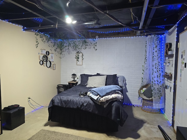 274 Pioneer St, Mendon, MI 49072 - bedroom featuring unfinished concrete flooring and brick wall