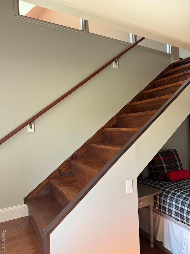 3981 Orchard Rd, Peck, MI 48466 - staircase with baseboards and wood finished floors