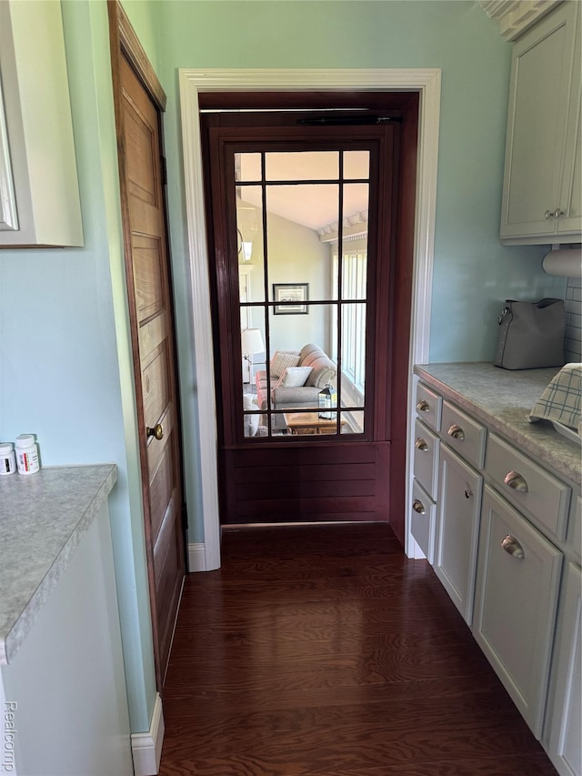 3981 Orchard Rd, Peck, MI 48466 - doorway with dark wood-style floors and baseboards