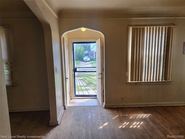 8850 Farmbrook St, Detroit, MI 48236 - foyer featuring wood finished floors and arched walkways