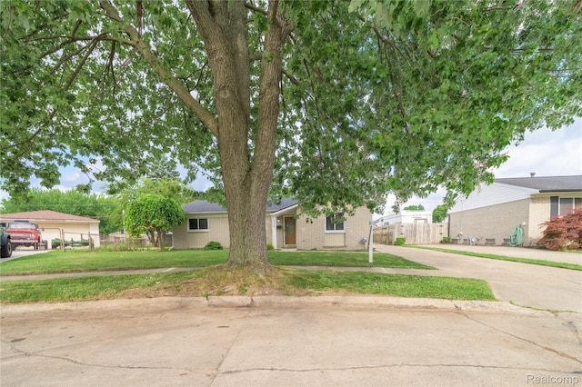 6448 Hunter Ct, Westland, MI 48185 - view of front of home featuring brick siding and driveway