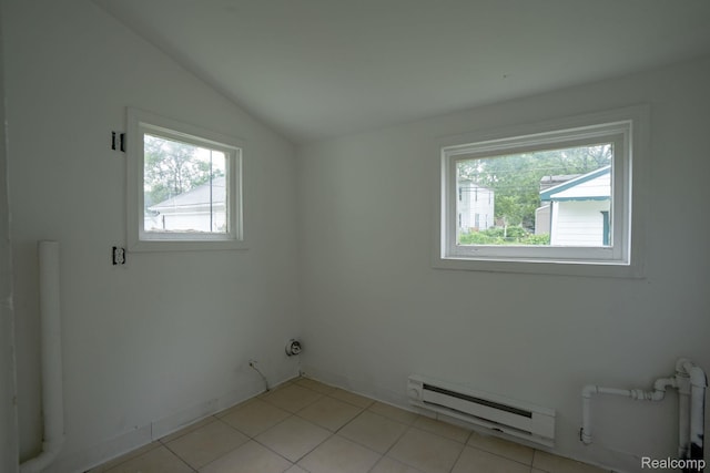 23199 Stewart Ave, Warren, MI 48089 - spare room with baseboard heating, plenty of natural light, lofted ceiling, and light tile patterned flooring