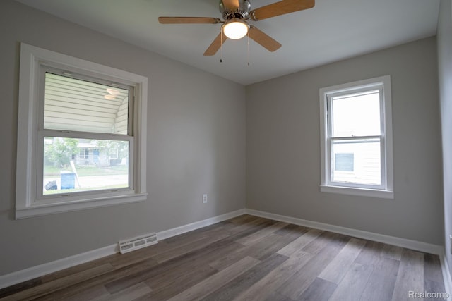 23199 Stewart Ave, Warren, MI 48089 - empty room featuring healthy amount of natural light, wood finished floors, and a ceiling fan