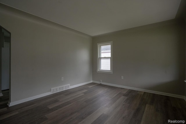 23199 Stewart Ave, Warren, MI 48089 - unfurnished room with dark wood-style floors