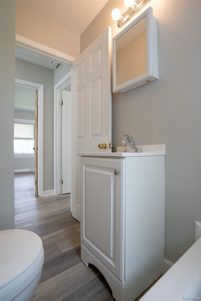 23199 Stewart Ave, Warren, MI 48089 - half bath featuring vanity and wood finished floors