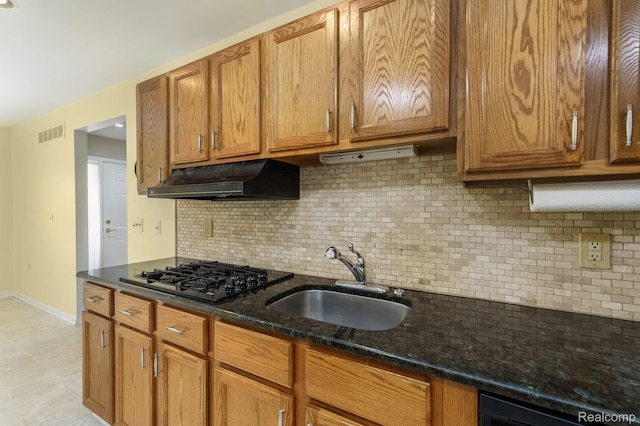 21433 Archwood Cir, Farmington Hills, MI 48336 - kitchen featuring under cabinet range hood, black gas cooktop, backsplash, and dark stone counters