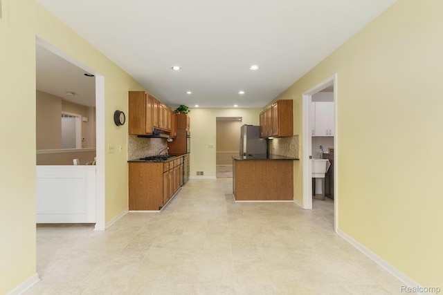 21433 Archwood Cir, Farmington Hills, MI 48336 - kitchen with appliances with stainless steel finishes, dark countertops, brown cabinets, and recessed lighting