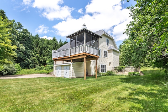 8150 Mester Rd, Chelsea, MI 48118 - rear view of property with a sunroom, a yard, a wooden deck, and a chimney