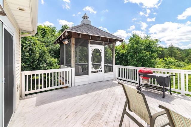 8150 Mester Rd, Chelsea, MI 48118 - wooden deck with a sunroom