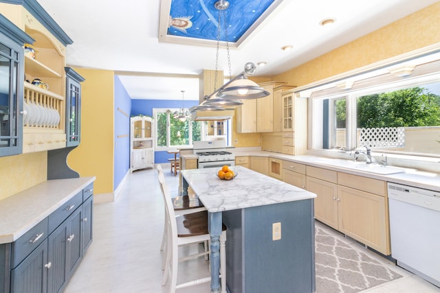 8150 Mester Rd, Chelsea, MI 48118 - kitchen with white appliances, a center island, decorative light fixtures, glass insert cabinets, and a kitchen breakfast bar