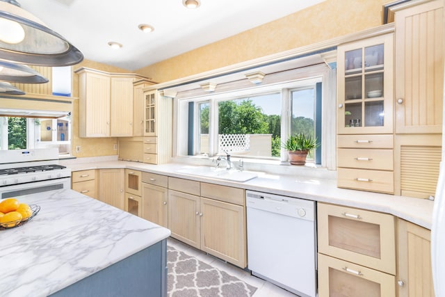 8150 Mester Rd, Chelsea, MI 48118 - kitchen featuring white appliances, light brown cabinetry, plenty of natural light, and glass insert cabinets