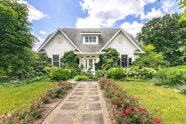 8150 Mester Rd, Chelsea, MI 48118 - view of front of home featuring a front lawn and a shingled roof