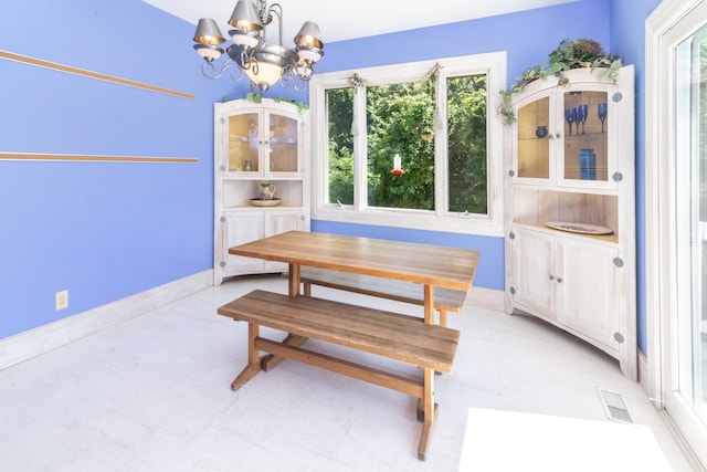 8150 Mester Rd, Chelsea, MI 48118 - dining room with a chandelier and baseboards