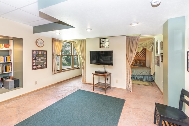8150 Mester Rd, Chelsea, MI 48118 - living area featuring baseboards and tile patterned floors