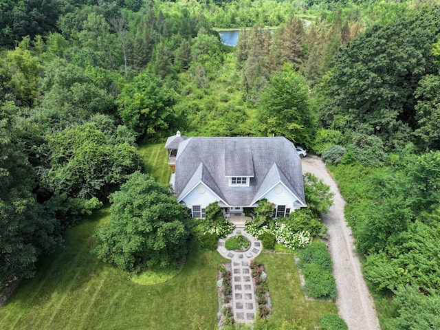 8150 Mester Rd, Chelsea, MI 48118 - aerial view of property and surrounding area with a heavily wooded area