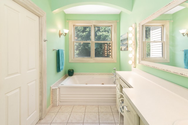 8150 Mester Rd, Chelsea, MI 48118 - bathroom featuring a whirlpool tub, vanity, and tile patterned flooring