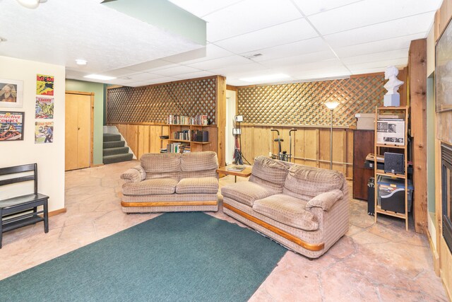 8150 Mester Rd, Chelsea, MI 48118 - living area with stairway and a drop ceiling