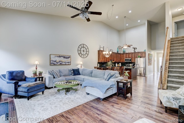 4361 Bennett Park Cir, Troy, MI 48085 - living area with ceiling fan, stairway, light wood finished floors, high vaulted ceiling, and recessed lighting