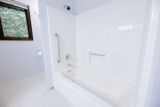 18400 N Fruitport Rd, Spring Lake, MI 49456 - bathroom with tub / shower combination and baseboards