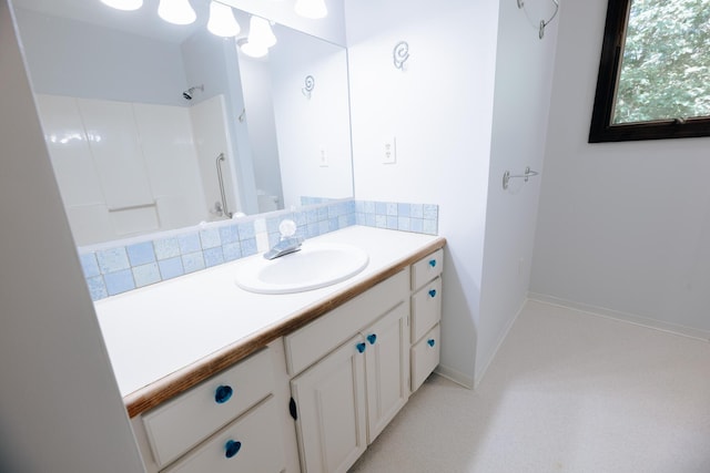 18400 N Fruitport Rd, Spring Lake, MI 49456 - full bathroom with vanity and baseboards