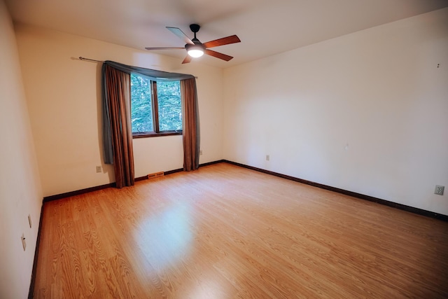 18400 N Fruitport Rd, Spring Lake, MI 49456 - spare room with light wood finished floors and a ceiling fan