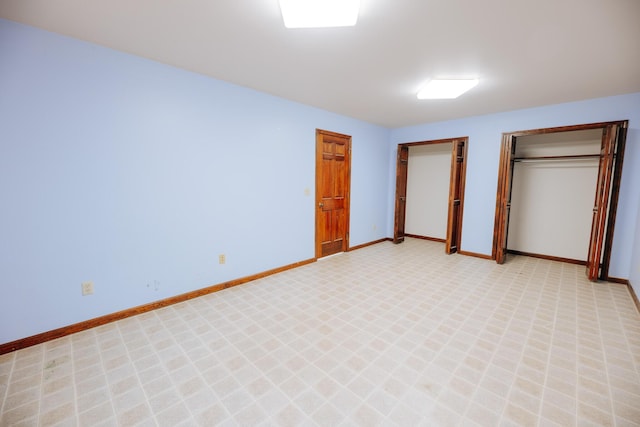 18400 N Fruitport Rd, Spring Lake, MI 49456 - unfurnished bedroom with two closets and baseboards