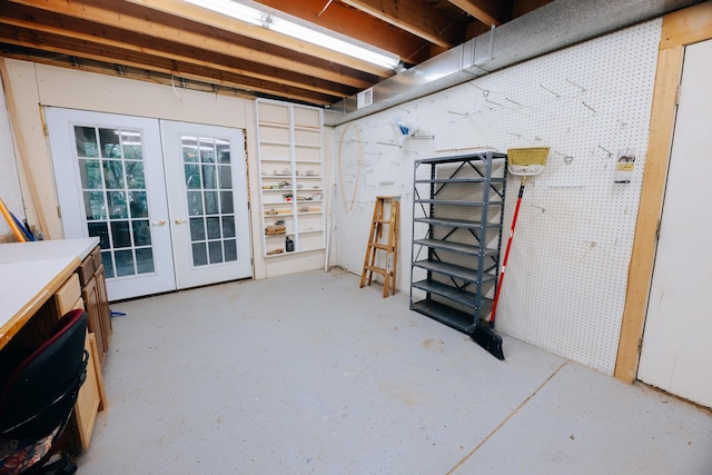 18400 N Fruitport Rd, Spring Lake, MI 49456 - below grade area featuring french doors and a workshop area