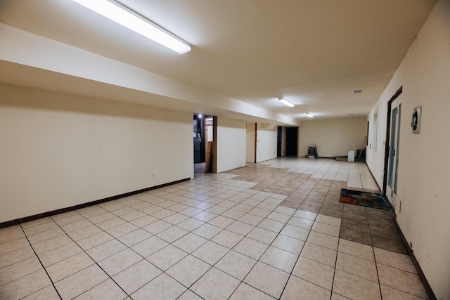 18400 N Fruitport Rd, Spring Lake, MI 49456 - empty room with light tile patterned flooring and baseboards