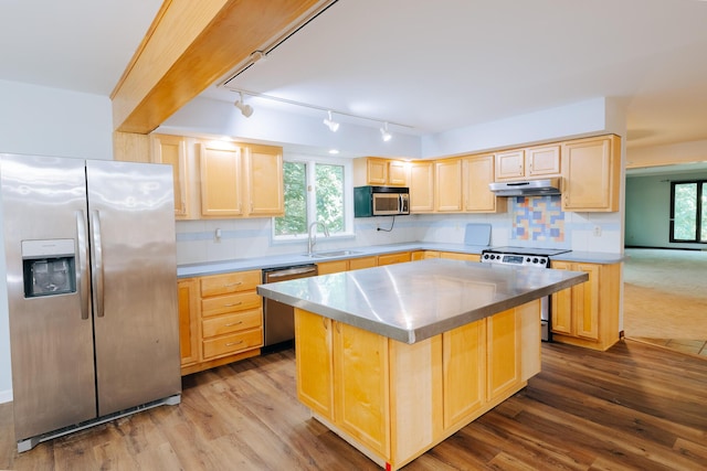 18400 N Fruitport Rd, Spring Lake, MI 49456 - kitchen featuring appliances with stainless steel finishes, light brown cabinets, and under cabinet range hood