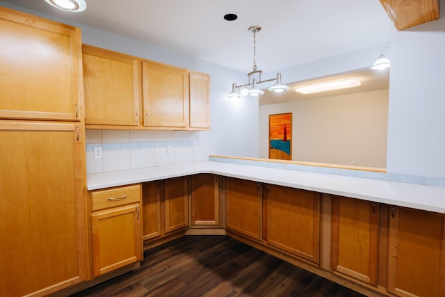 18400 N Fruitport Rd, Spring Lake, MI 49456 - kitchen with light countertops, dark wood-style floors, tasteful backsplash, and hanging light fixtures