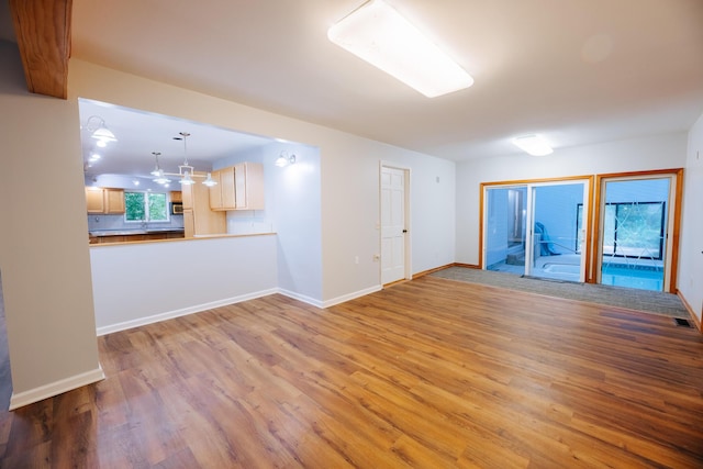 18400 N Fruitport Rd, Spring Lake, MI 49456 - unfurnished room featuring light wood-style flooring and baseboards