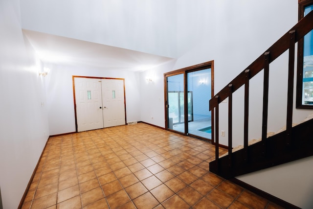 18400 N Fruitport Rd, Spring Lake, MI 49456 - entrance foyer featuring a towering ceiling and tile patterned floors