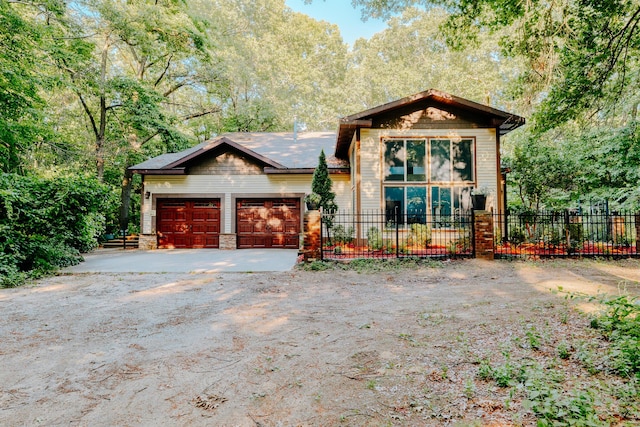18400 N Fruitport Rd, Spring Lake, MI 49456 - view of front of property with dirt driveway, a garage, and stone siding