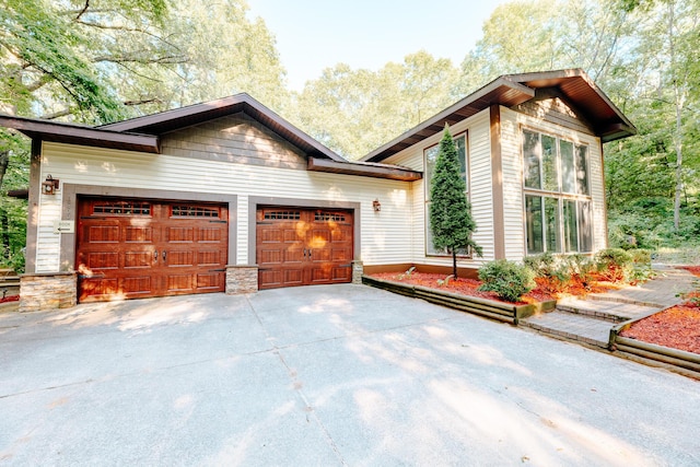 18400 N Fruitport Rd, Spring Lake, MI 49456 - view of side of property featuring concrete driveway and a garage