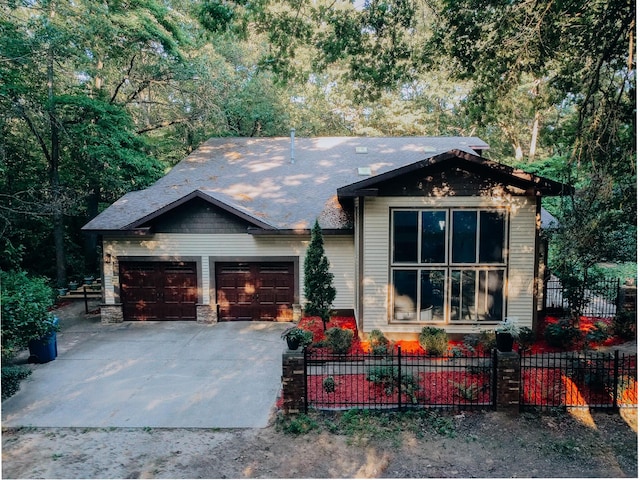 18400 N Fruitport Rd, Spring Lake, MI 49456 - view of front of house with a garage, driveway, and a fenced front yard