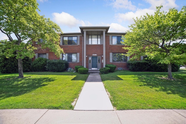 32708 Harper Ave Unit 5, Saint Clair Shores, MI 48082 - greek revival inspired property with brick siding and a front yard