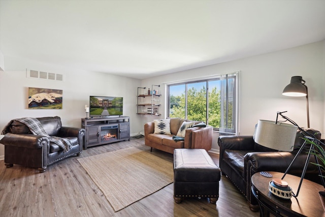 32708 Harper Ave Unit 5, Saint Clair Shores, MI 48082 - living room with wood finished floors and a fireplace