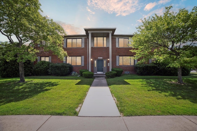 32708 Harper Ave Unit 5, Saint Clair Shores, MI 48082 - greek revival house featuring brick siding and a lawn