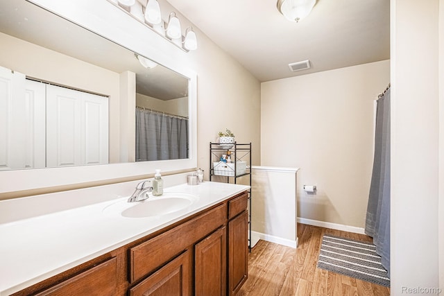 16621 Charles Town Ct, Linden, MI 48451 - bathroom with wood finished floors and vanity