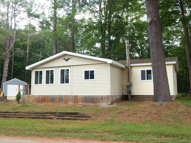 2322 Tittabawassee Ave, Alger, MI 48610 - view of property exterior featuring a garage