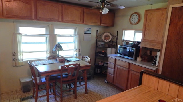 2319 Tittabawassee Ave, Alger, MI 48610 - dining area with a ceiling fan and plenty of natural light