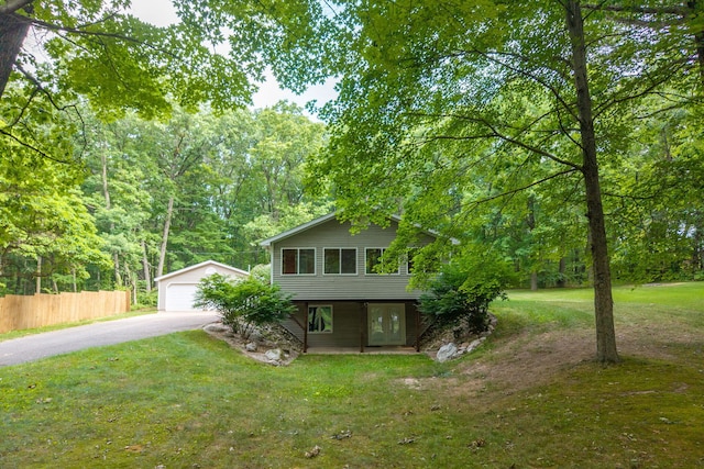 23974 Hooker Dr, Sand Lake, MI 49343 - tri-level home featuring an outdoor structure, a garage, and french doors